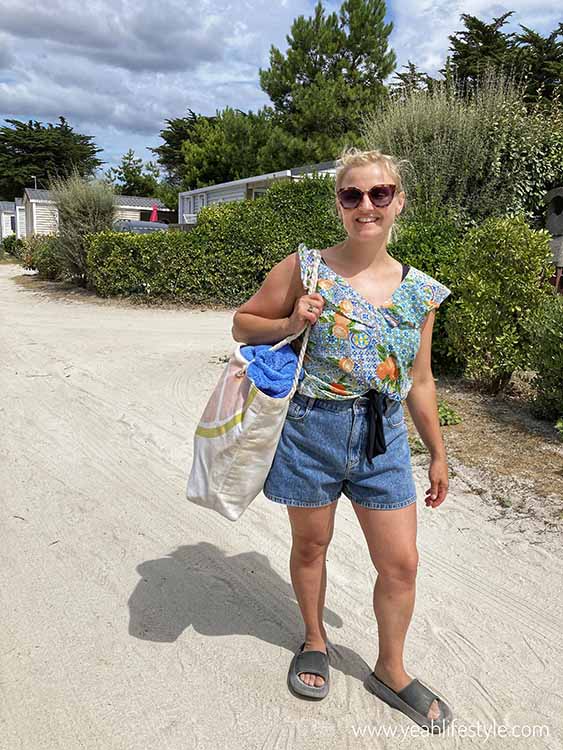 Woman wearing shorts and floral top